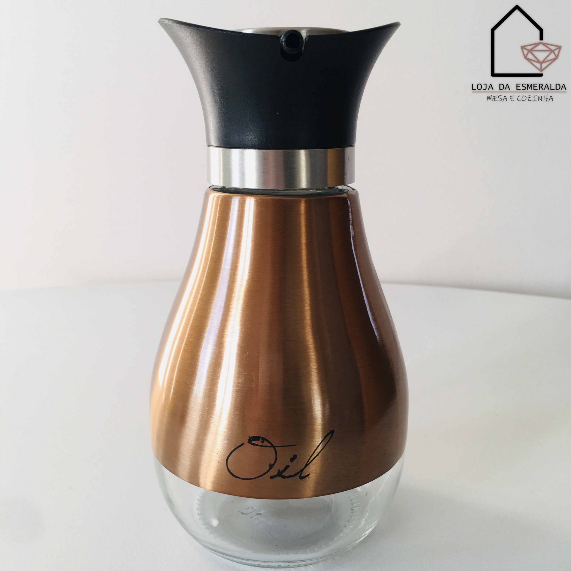 Recipiente para azeite metálico bronze com base de vidro e tampa preta, texto 