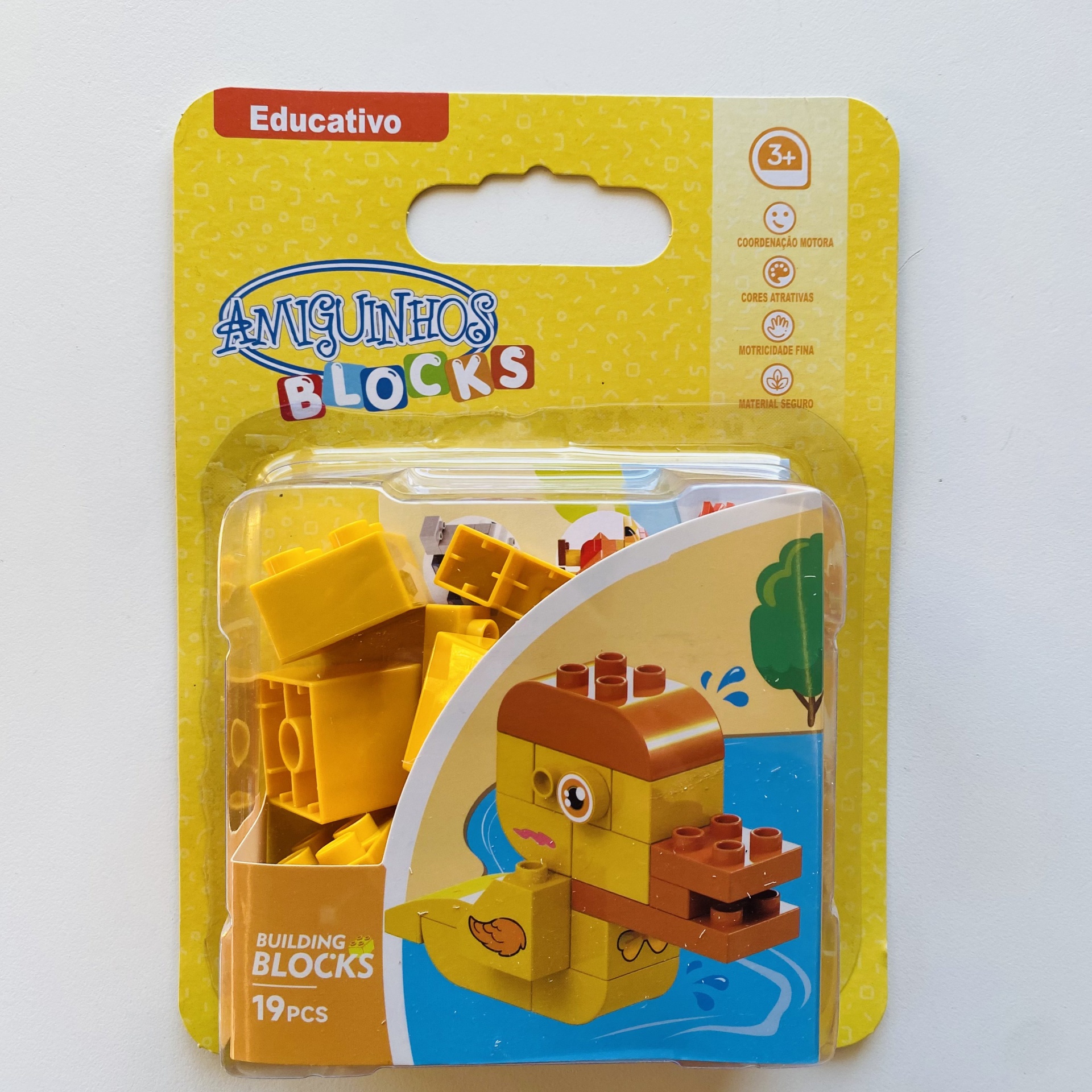Blocos de construção Amiguinhos Blocks com figura de pato amarelo e castanho