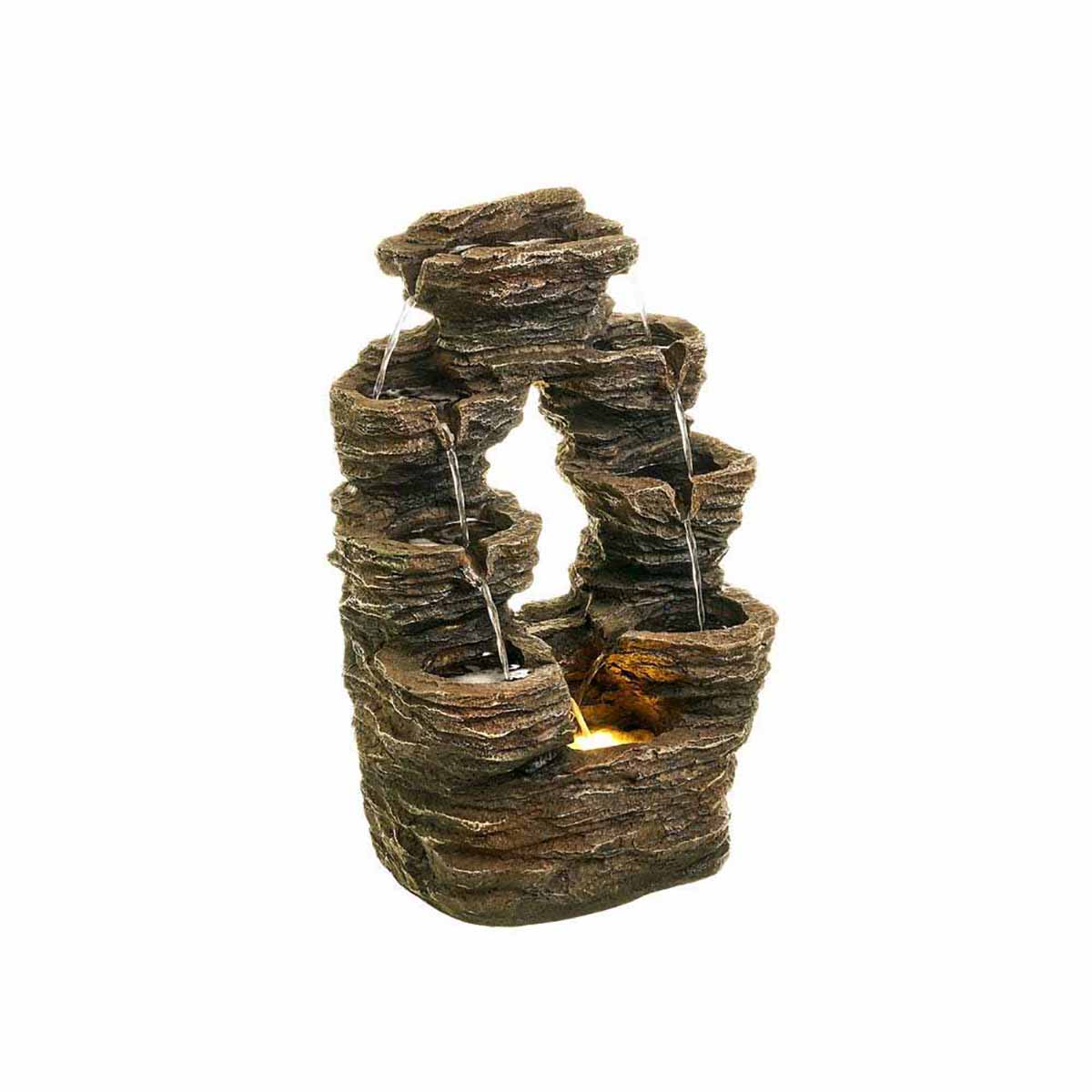 Fonte decorativa de pedra com água e luz amarela