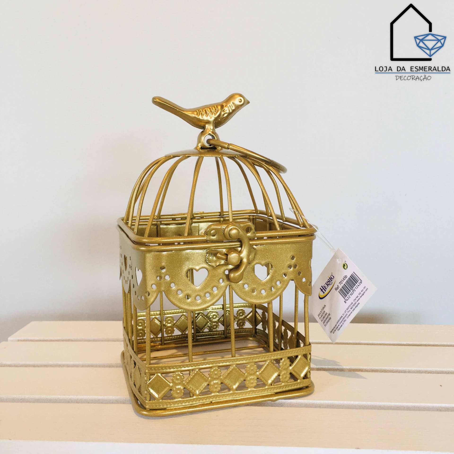Gaiola decorativa dourada com pássaro e padrão de corações
