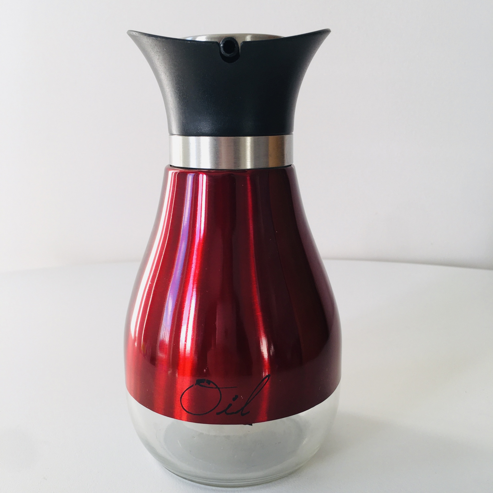 Recipiente para óleo transparente com tampa preta e corpo vermelho