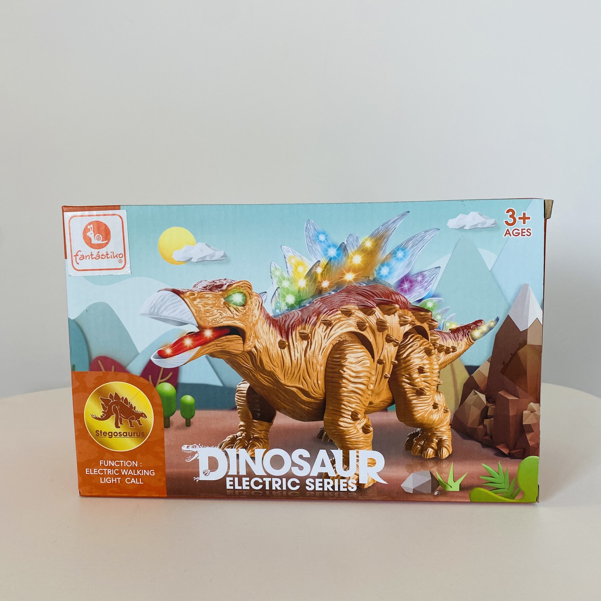 Brinquedo dinossauro tricerátopo elétrico com luzes coloridas e caixa decorativa