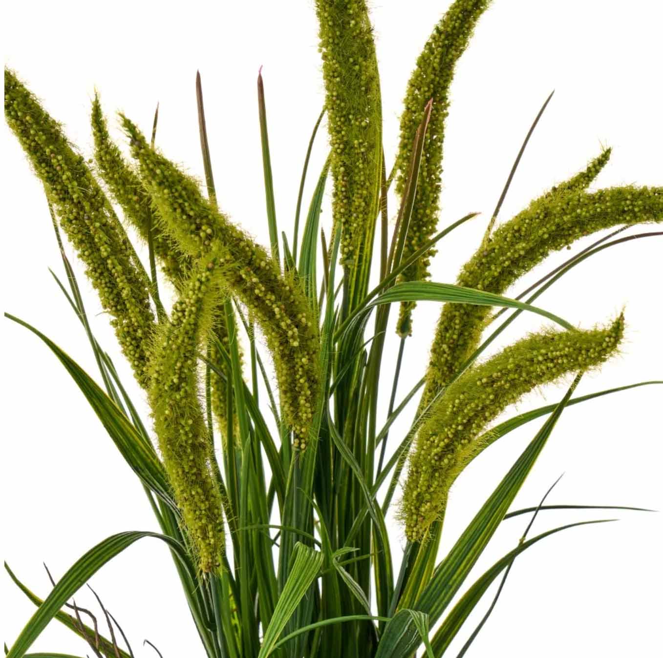 Planta artificial verde com folhas longas e flores compridas texturizadas.