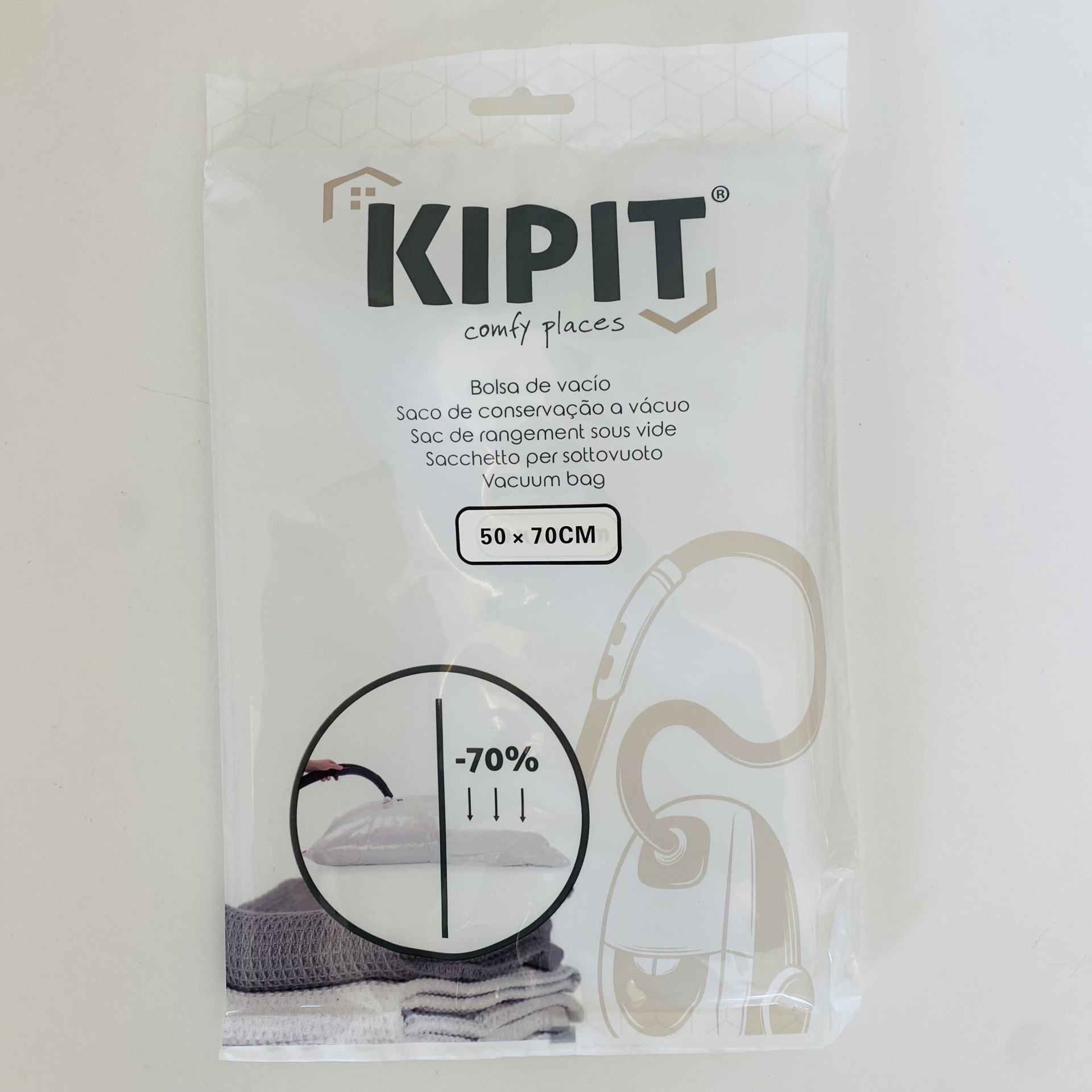 Embalagem branca de saco de vácuo Kipit 50x70 cm com texto e gráfico de redução de volume.