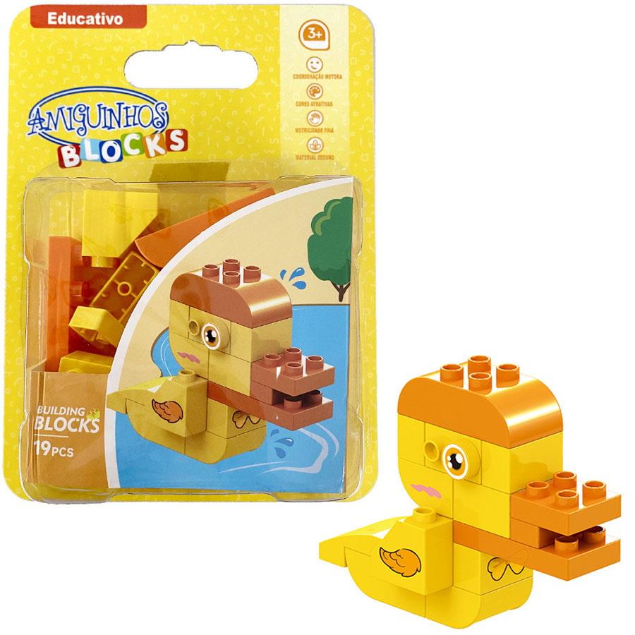 Conjunto de blocos de construção amarelo e castanho em forma de pato, embalagem amarela