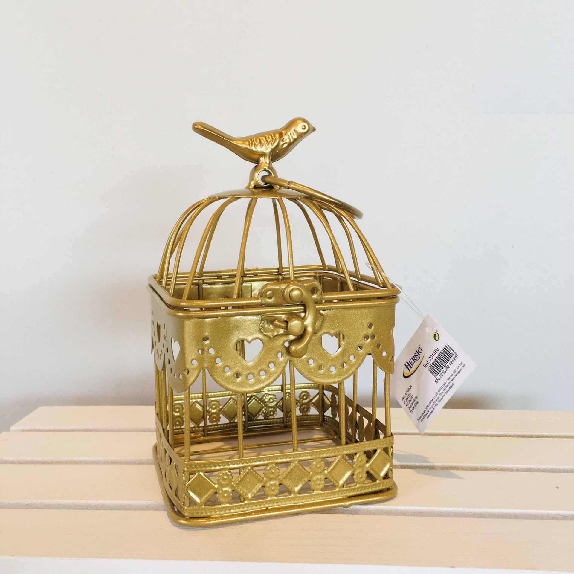 Gaiola decorativa dourada de metal com pássaro no topo