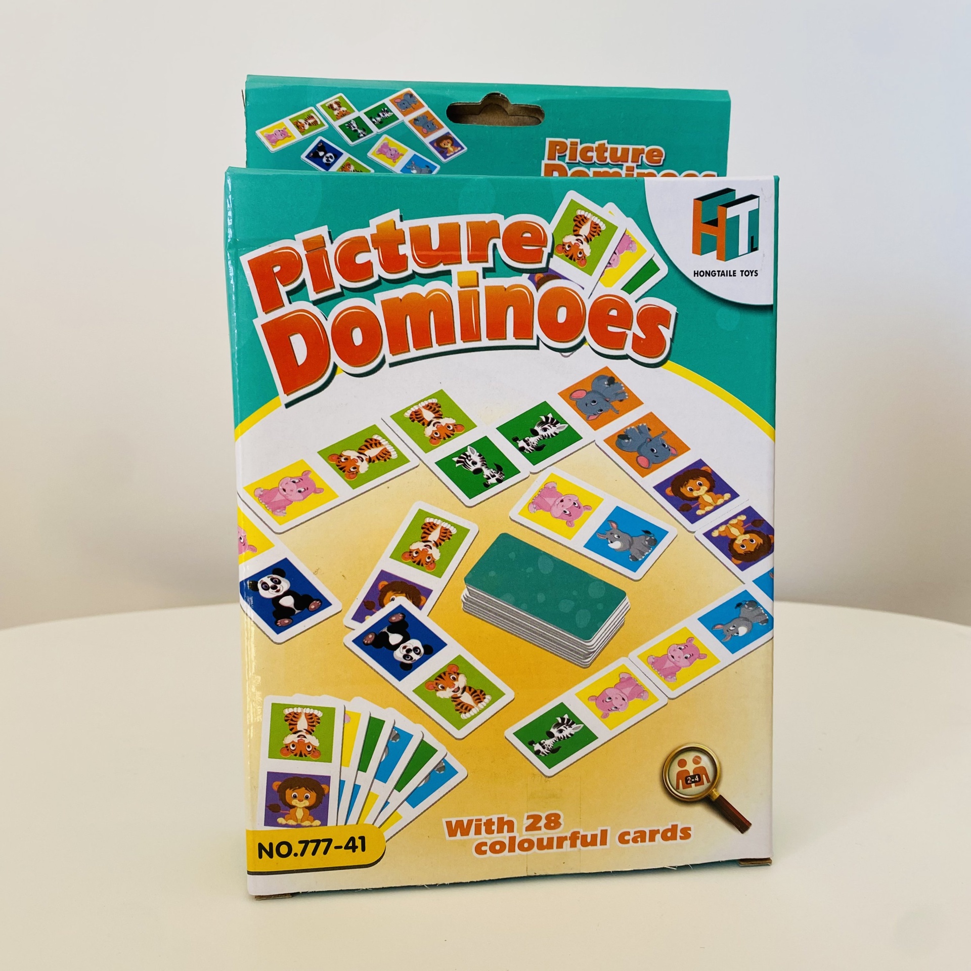 Caixa do jogo Picture Dominoes com peças ilustradas de animais coloridos