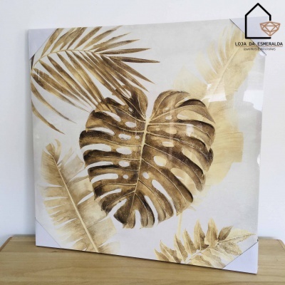 quadro decorativo com folhas douradas em fundo claro