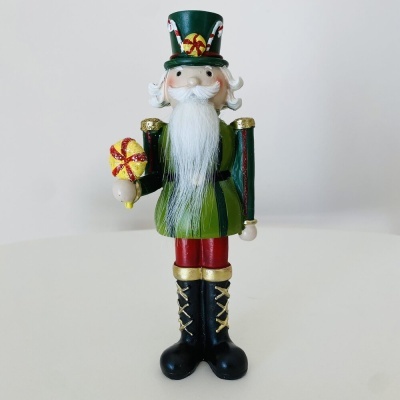 Figura de soldadinho de chumbo verde com presente
