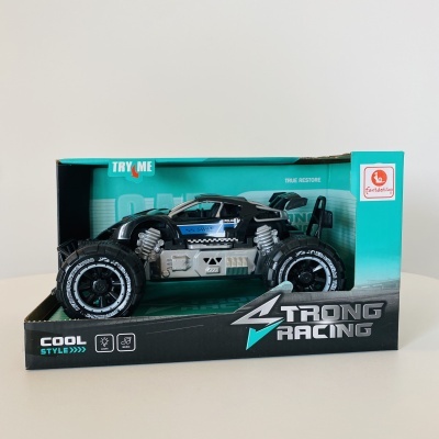 Carrinho de corrida preto azul e cinzento em embalagem azul e preta 'Strong Racing'.