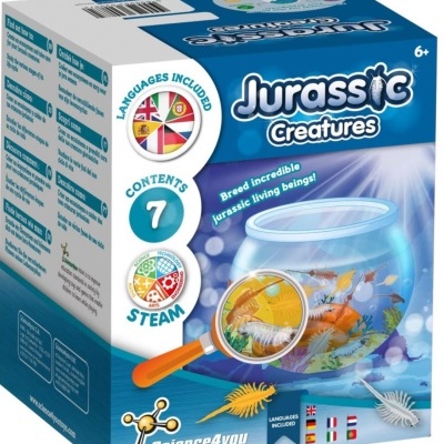 Caixa do kit Jurassic Creatures com aquário, lupa e criaturas coloridas