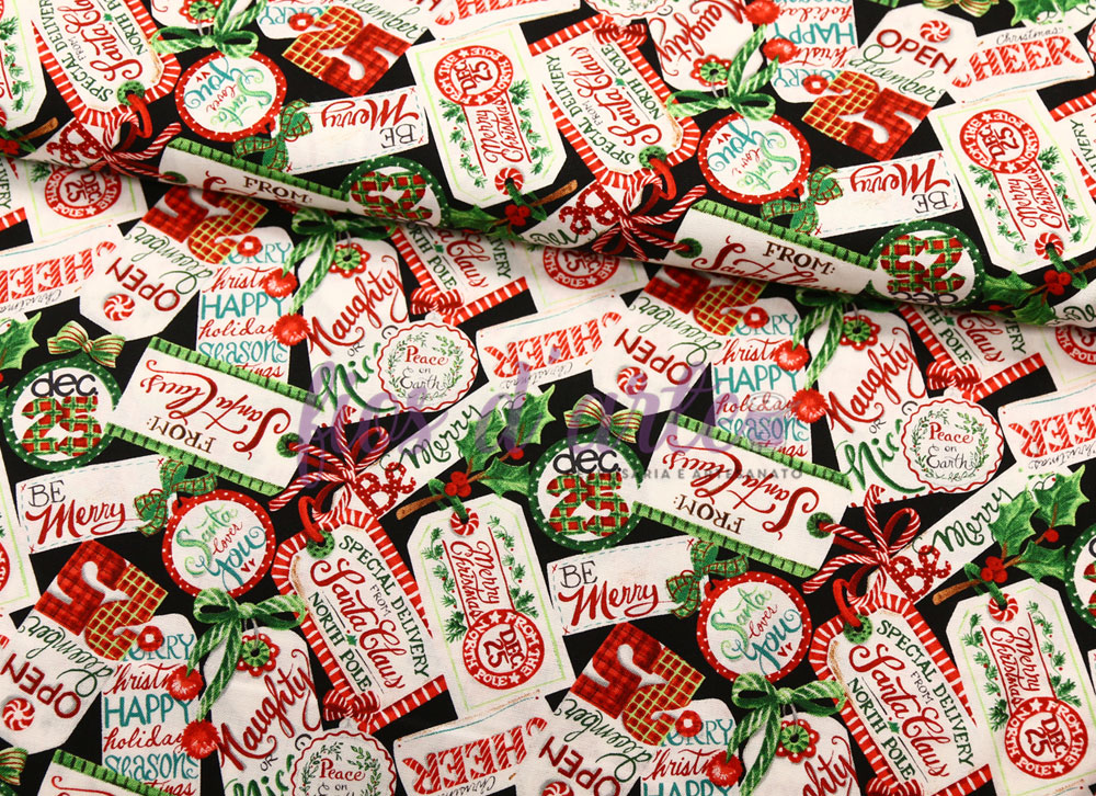 Tecido festivo com etiquetas natalícias coloridas e mensagens inspiradoras