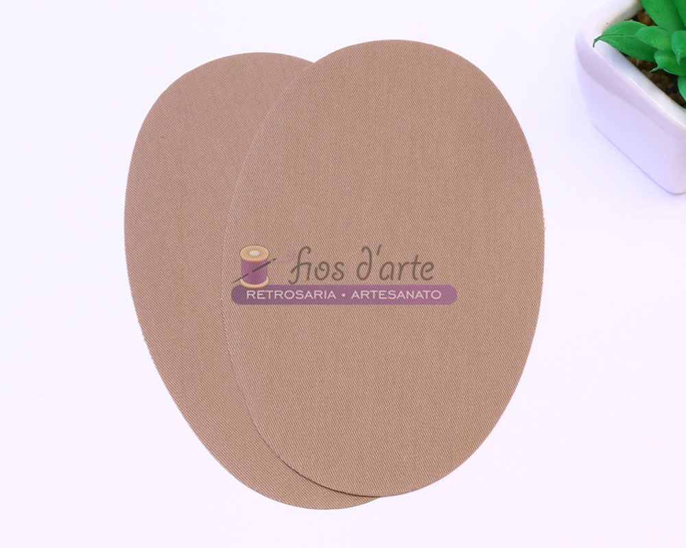 Joelheiras/ Cotoveleiras Termocolantes - bege Almofadas ovais beige com texto 'fios d'arte RETROSARIA - ARTESANATO' e vaso com planta verde