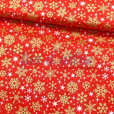 Tecido vermelho com flocos de neve dourados e brancos estampados