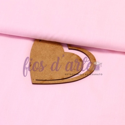tecido rosa claro com molde de papel castanho e texto 'fios d' arte'