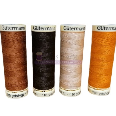 Quatro rolos de linha Gütermann em castanho, preto, bege e laranja, 110 yds cada.