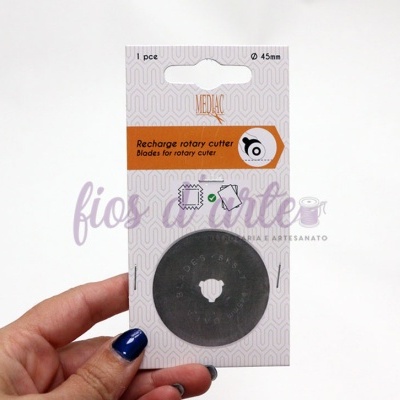 Disco de corte rotativo para recarga em embalagem com fundo branco e detalhes laranja