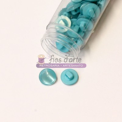 Frasco transparente com botões azuis claros redondos
