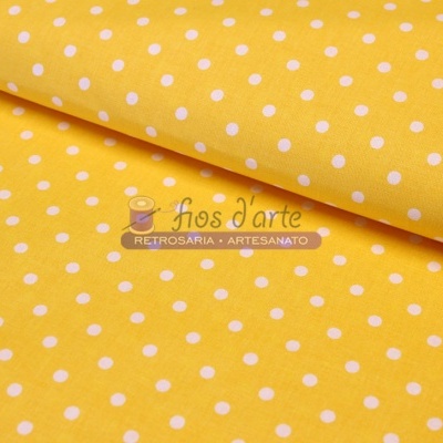 Tecido amarelo com bolinhas brancas e marca d'arte