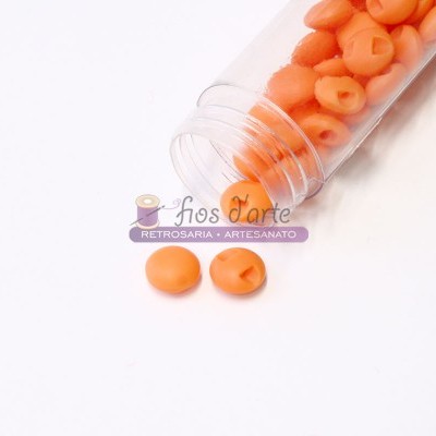 Frasco transparente com tampo cor-de-rosa e contas laranja