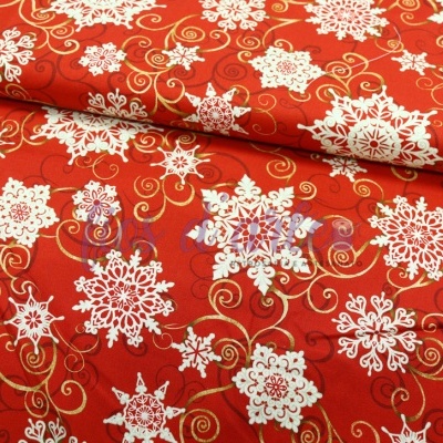 Tecido vermelho com flocos de neve brancos e detalhes dourados