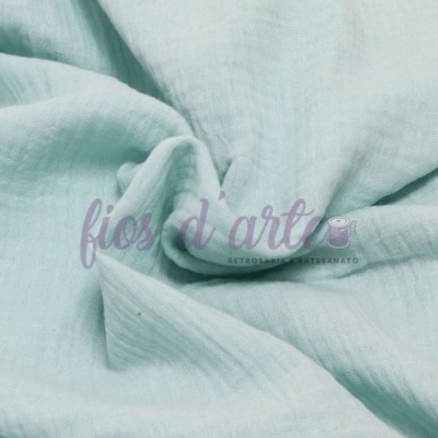 Tecido de algodão azul claro com marca 'fios d'art'