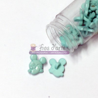 Botões azuis turquesa em forma da cabeça do Mickey Mouse e frasco transparente aberto