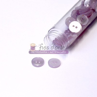 Frasco transparente com botões lilás translúcidos e texto impresso