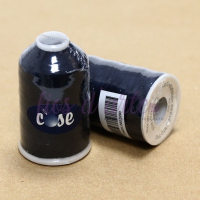 Dois cones de linha azul escuro com base branca sobre superfície bege