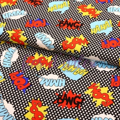 Tecido com padrão de pontos e palavras de banda desenhada coloridas