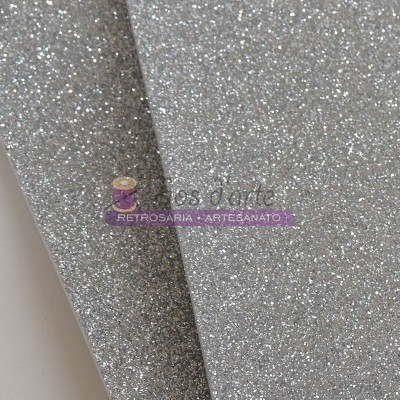 Dois pedaços de papel glitter prateado e cinzento lado a lado com texto RETROSARIA ARTE&ANATO