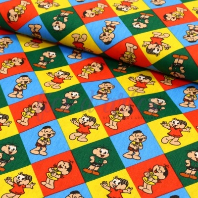 Tecido colorido com padrão de quadrados e personagens de banda desenhada