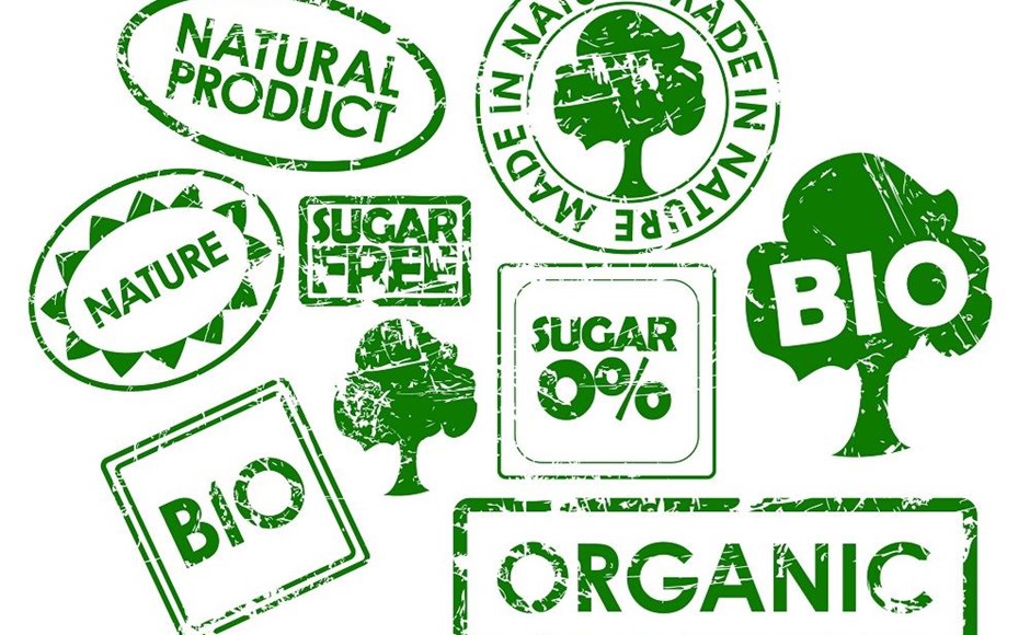 Carimbos verdes com textos sobre produtos naturais e orgânicos, incluindo árvores