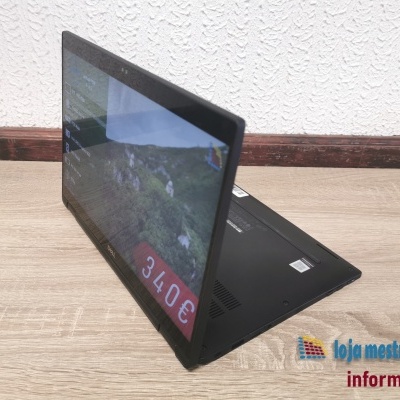 Computador portátil Dell preto com ecrã táctil a 90 graus e preço visível