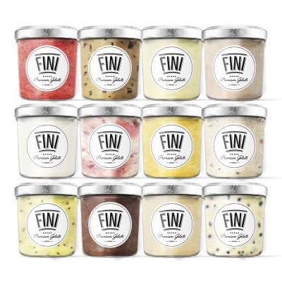 Doze frascos de gelado FINI Premium Gelato em diferentes cores e texturas com tampas prateadas
