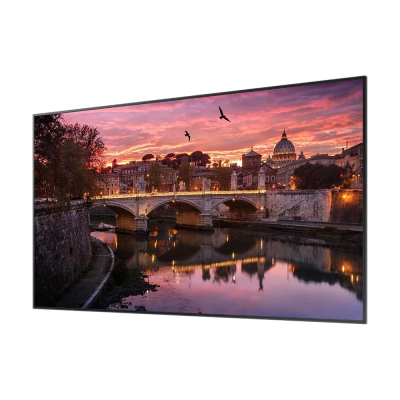 Ecrã plano curvo com imagem de pôr-do-sol à beira de um rio com ponte e edifícios
