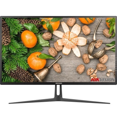 Monitor HIKVISION mostrando imagem de tangerinas, nozes, pinhas e ramos de pinheiro