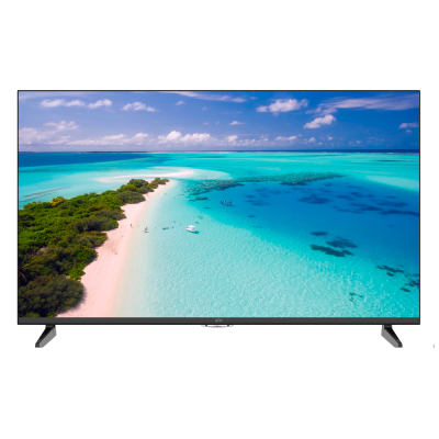 Televisor com imagem de praia de areia branca e água turquesa