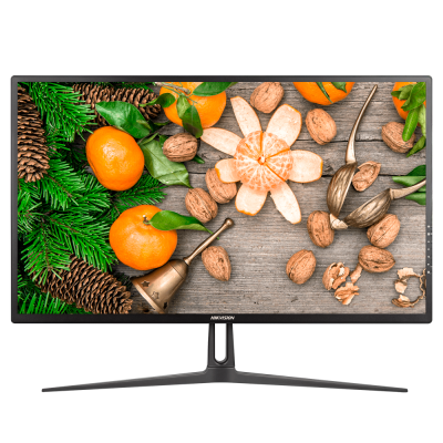 Monitor preto com imagem de tangerinas, nozes, pinhas e ramos de pinheiro sobre madeira