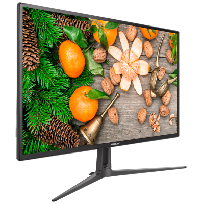 Monitor de computador mostrando imagem de tangerinas e frutos secos sobre madeira