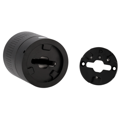 Componente cilíndrico preto e placa redonda preta com molas numa superfície branca