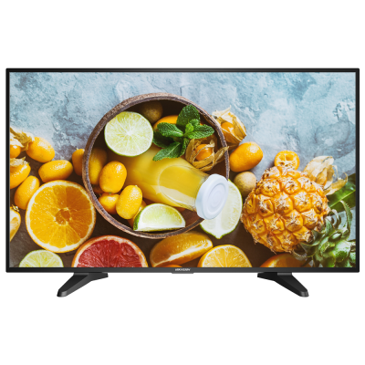 Televisor preto a mostrar imagem de frutos cítricos e sumo