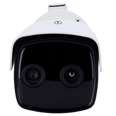 Câmara de vigilância branca com duas lentes numa superfície preta brilhante