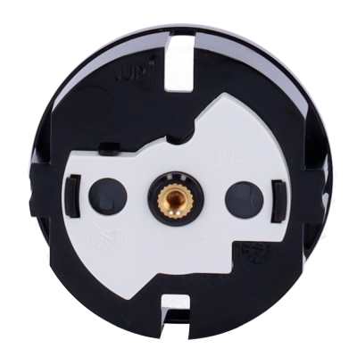 Componente circular preto e branco com peça central metálica dourada e texto '1UP'