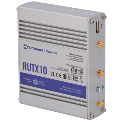 Dispositivo eletrônico Teltonika Networks RUTX10 cinzento com etiquetas azul e branca e várias portas.