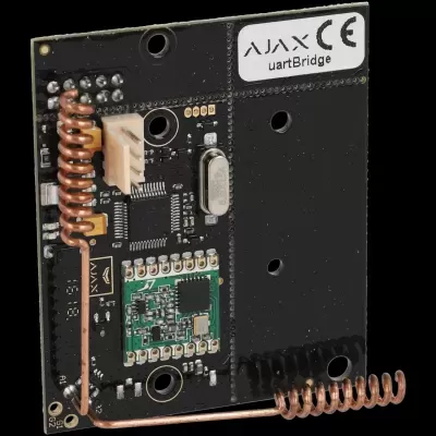 Placa eletrónica preta com bobinas de cobre e etiqueta AJAX uartBridge.