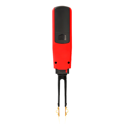 Dispositivo electrónico rojo y negro con pinzas metálicas doradas
