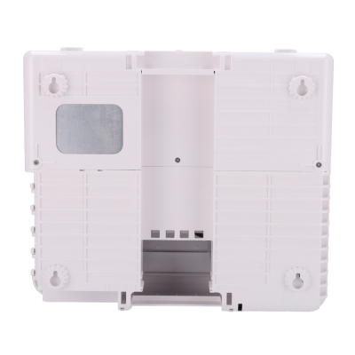 Parte inferior de dispositivo eletrónico branco com painel metálico e apoios circulares