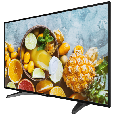 Televisor LED preto a mostrar imagem de frutas e sumo em recipiente de madeira