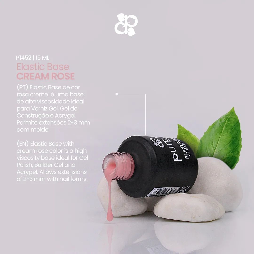 Frasco de verniz gel rosa creme sobre pedras brancas com folha verde